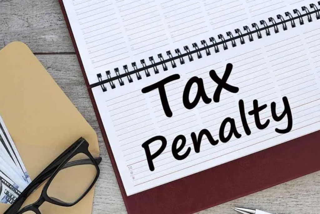 (In the image a pen can be seen along with tax penalty written on a diary)
