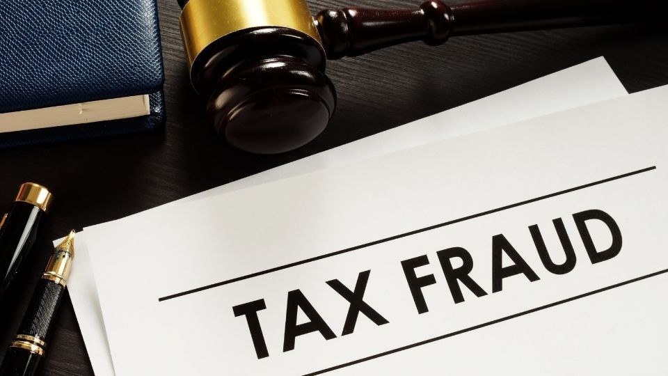 (An image can be seen clearly mentioning Tax fraud)