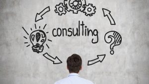 In the image a man can be seen figuring out how consultancy can help in business growth.