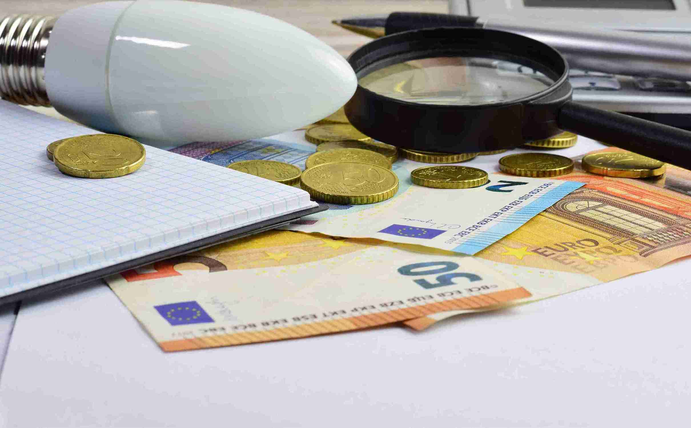 Image illustrating tips for saving money on taxes, featuring charts, calculators, and tax forms.