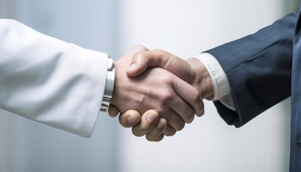 Business handshake signifying a contract, compliance agreement, or professional guidance for new airbnb rules.