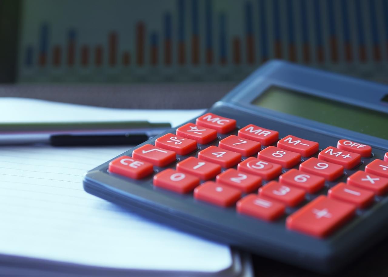 A close-up view of a calculator on a desk, commonly used for financial calculations or accounting.